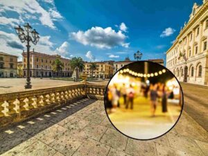 sfondo città Sassari e tondo festival con luci